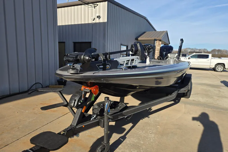 Slide: The Image of 2026 Skeeter ZXE21 fishing boat on trailer outside a building. - 41