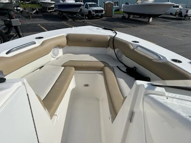 Slide: The Image of 2020 Key West 239 DFS boat interior with cushioned seating and speakers. - 13