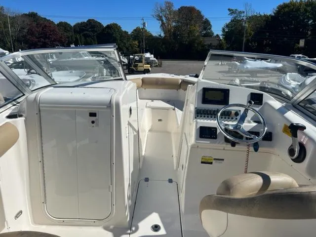 Slide: The Image of 2020 Key West 239 DFS boat interior with steering console and seating. - 15
