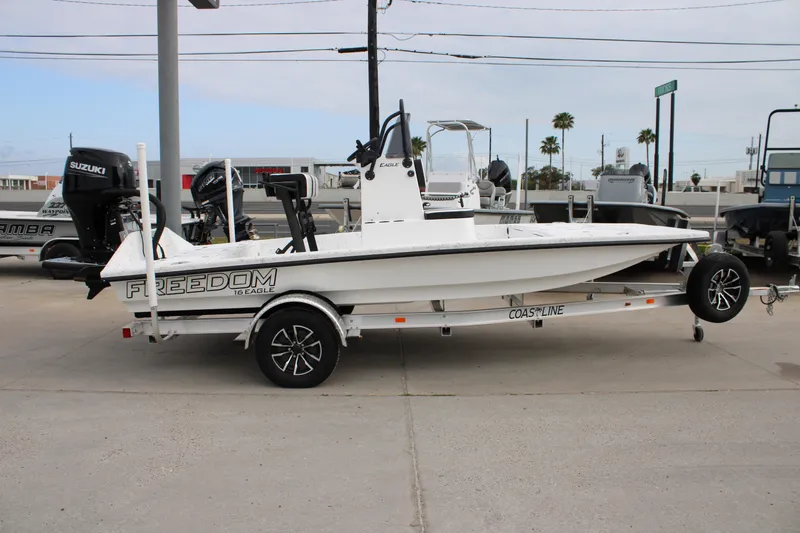 The Image of 2026 Freedom Boats 16' Eagle on trailer, parked outdoors, side view. - 0