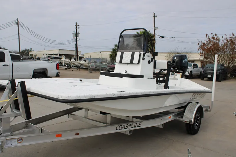 Slide: The Image of 2026 Freedom Boats 16' Eagle on trailer, parked outdoors. - 1