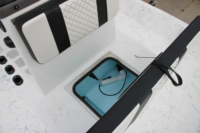 Slide: The Image of 2026 Freedom Boats 16' Eagle interior with storage compartment and cushioned seating. - 10