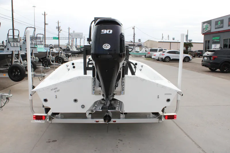 Slide: The Image of 2026 Freedom Boats 16' Eagle with 90 HP motor on trailer in dealership lot. - 3