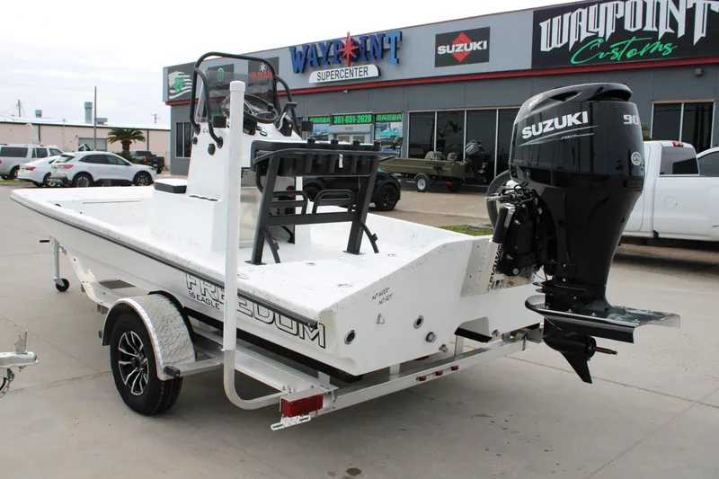 Slide: The Image of 2026 Freedom Boats 16' Eagle with Suzuki engine at dealership. - 4