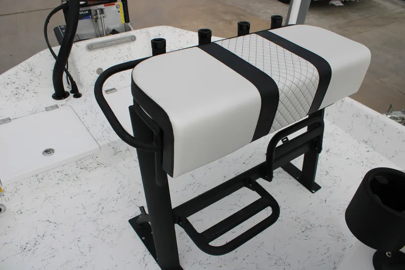 Slide: The Image of 2026 Freedom Boats 16' Eagle interior with cushioned seating and rod holders. - 11