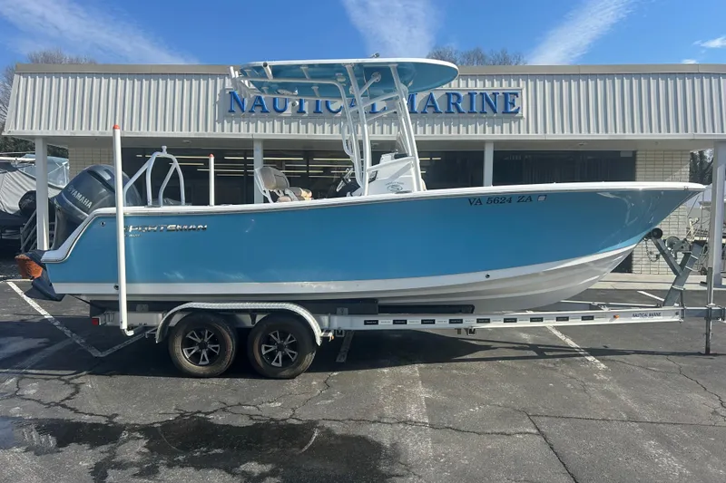 The Image of 2020 Sportsman Heritage 231 Center Console boat on trailer outside Nautical Marine. - 0