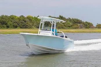 Slide: The Image of 2020 Sportsman Heritage 231 Center Console boat interior with helm and seating. - 10