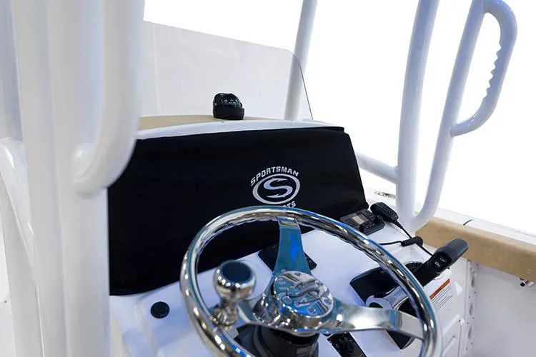 Slide: The Image of 2020 Sportsman Heritage 231 Center Console boat with tan seating and outboard motor. - 17