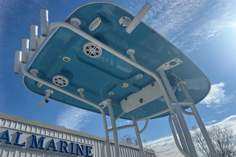 Slide: The Image of 2020 Sportsman Heritage 231 Center Console T-top against blue sky background. - 6