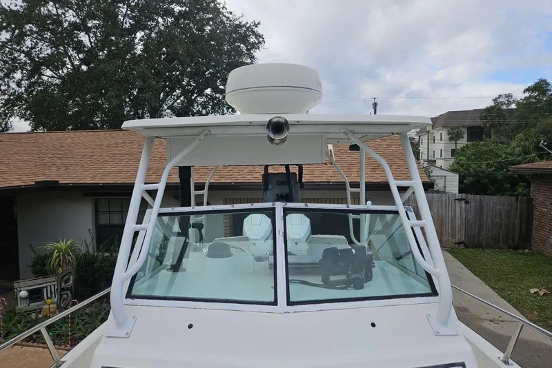 Slide: The Image of 1990 Hydra-Sports Vector 2500 CC boat with radar, parked in residential driveway. - 10