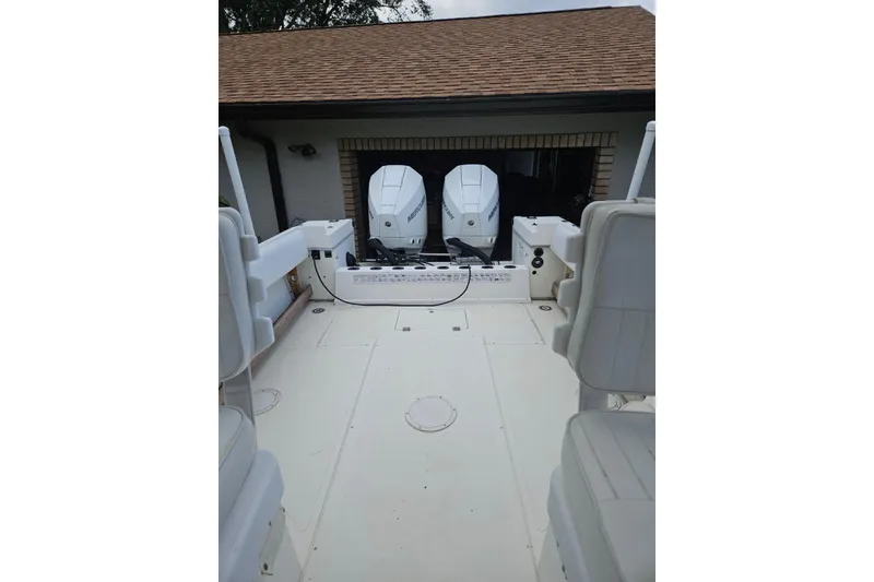 Slide: The Image of 1990 Hydra-Sports Vector 2500 CC boat with dual Mercury engines in a garage. - 11