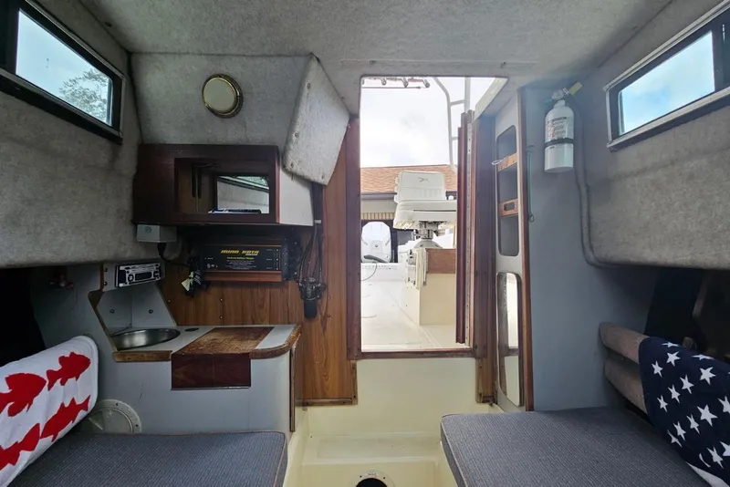 Slide: The Image of Interior of 1990 Hydra-Sports Vector 2500 CC boat with seating and equipment. - 9