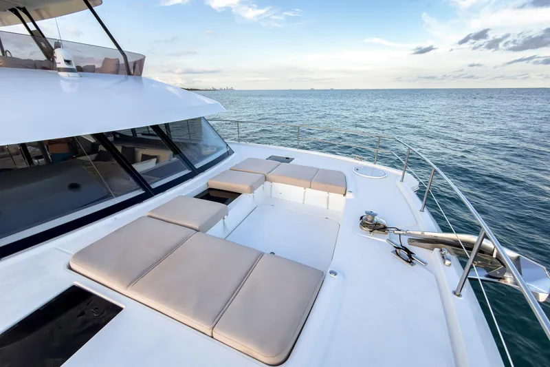 Slide: The Image of Fountaine Pajot MY6 2022 yacht deck with sun loungers on the sea. - 16