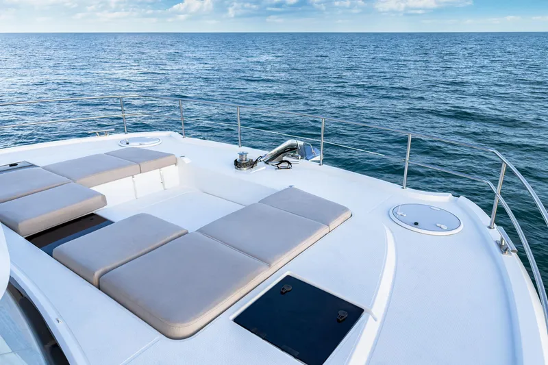 Slide: The Image of 2022 Fountaine Pajot MY6 yacht deck with sun loungers on open sea. - 18