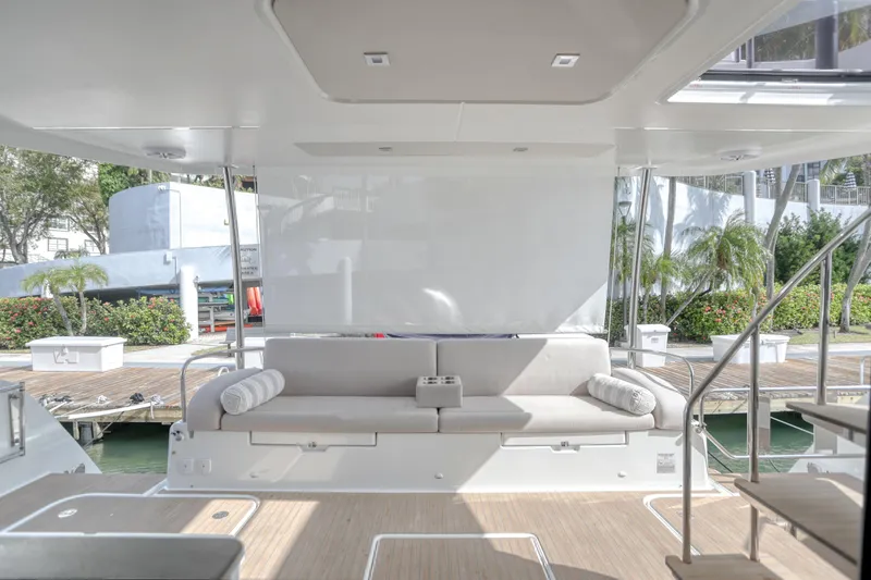 Slide: The Image of Luxurious 2022 Fountaine Pajot MY6 yacht interior with elegant seating and modern design. - 20
