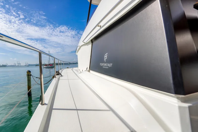 Slide: The Image of 2022 Fountaine Pajot MY6 yacht deck with ocean view and clear blue sky. - 23