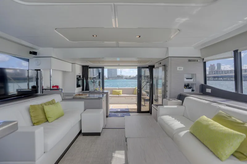 Slide: The Image of Luxurious interior of 2022 Fountaine Pajot MY6 yacht with modern furnishings and waterfront view. - 26