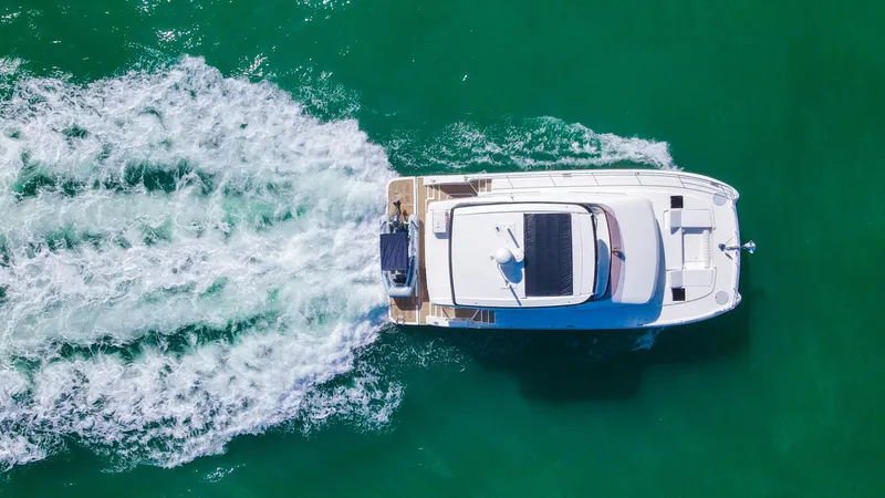 Slide: The Image of Aerial view of 2022 Fountaine Pajot MY6 yacht cruising on turquoise water. - 3