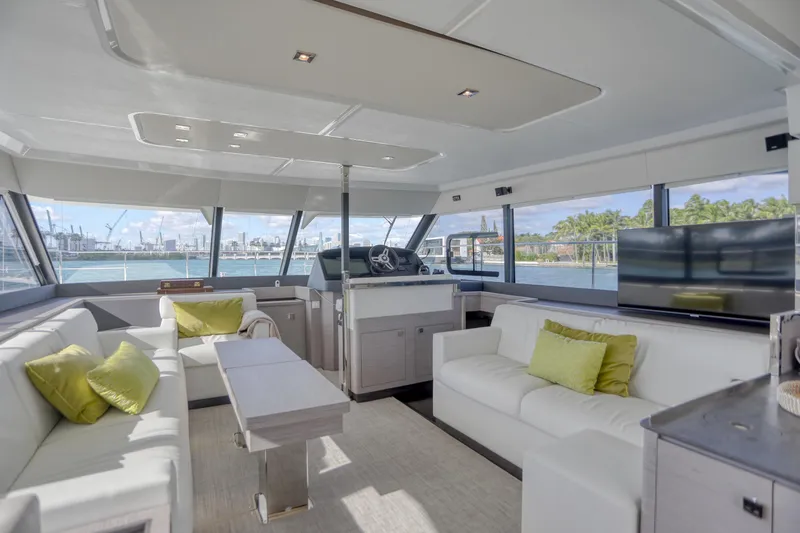 Slide: The Image of Luxurious interior of 2022 Fountaine Pajot MY6 yacht with modern seating and panoramic windows. - 32