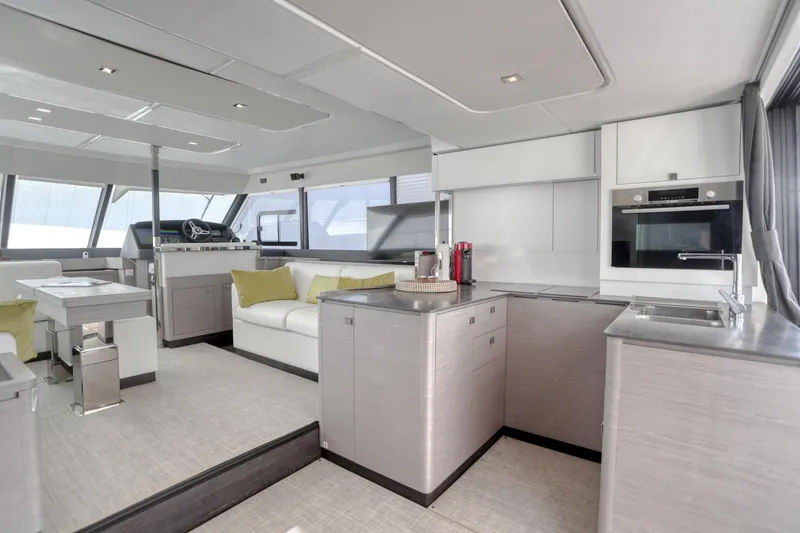 Slide: The Image of Luxurious interior of 2022 Fountaine Pajot MY6 yacht with modern kitchen and seating area. - 33