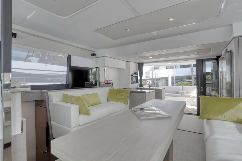 Slide: The Image of Luxurious interior of 2022 Fountaine Pajot MY6 yacht with modern furnishings and ample natural light. - 34