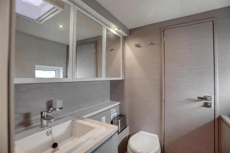 Slide: The Image of Modern bathroom interior on 2022 Fountaine Pajot MY6 yacht, featuring sleek design and fixtures. - 36