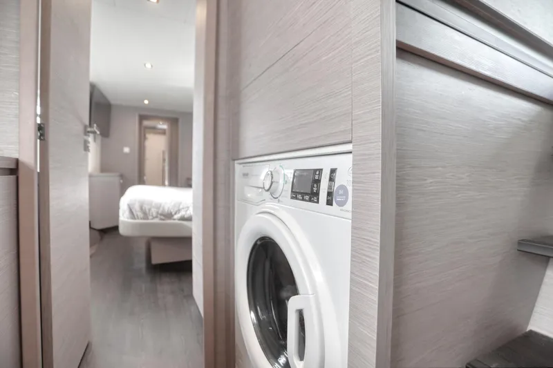 Slide: The Image of Interior of 2022 Fountaine Pajot MY6 yacht with washing machine and bedroom view. - 37