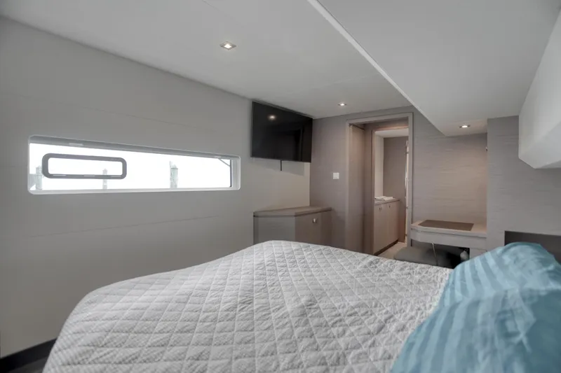 Slide: The Image of Modern bedroom interior on 2022 Fountaine Pajot MY6 yacht, featuring sleek design and natural light. - 38