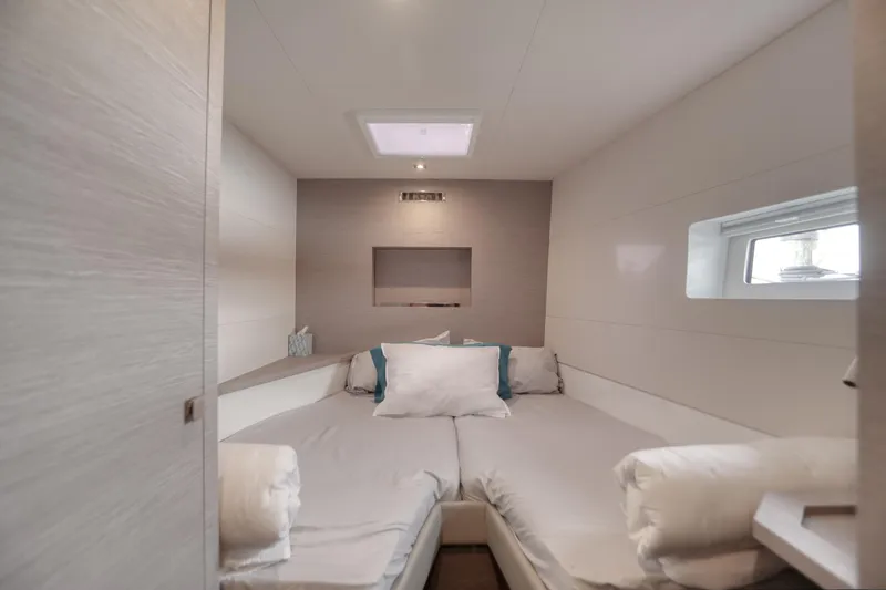 Slide: The Image of Luxurious cabin interior of 2022 Fountaine Pajot MY6 yacht, featuring cozy bedding and modern design. - 39