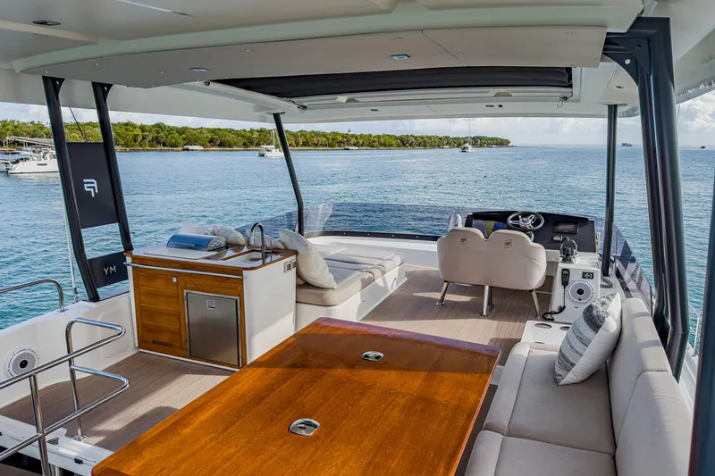 Slide: The Image of Luxurious 2022 Fountaine Pajot MY6 yacht interior with scenic ocean view. - 4