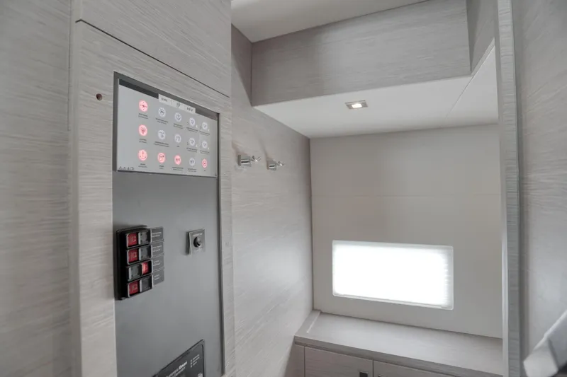 Slide: The Image of Control panel area inside 2022 Fountaine Pajot MY6 yacht, featuring modern design and lighting. - 42