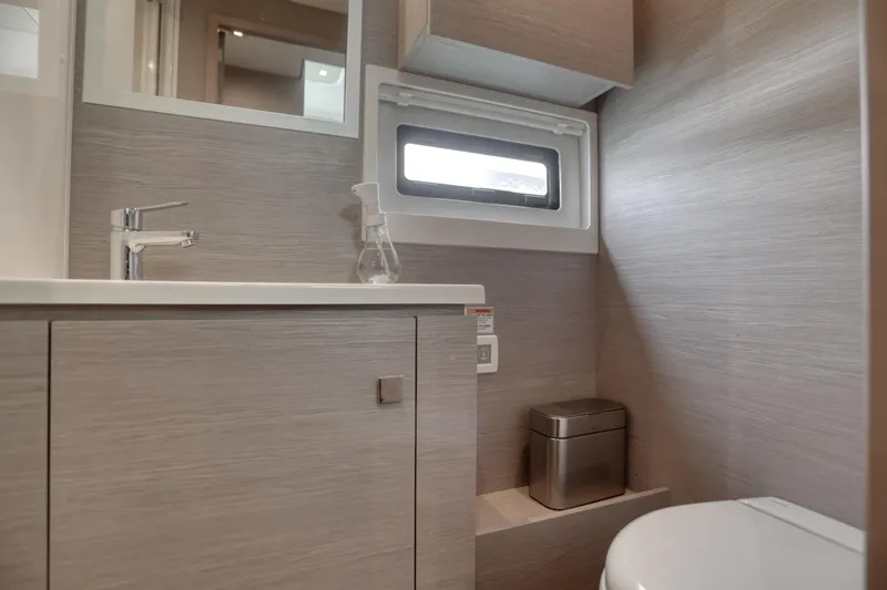 Slide: The Image of Modern bathroom interior on 2022 Fountaine Pajot MY6 yacht, featuring sleek design and compact amenities. - 43
