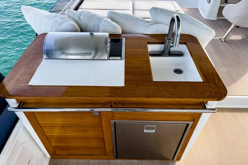 Slide: The Image of Outdoor kitchen on 2022 Fountaine Pajot MY6 yacht with sink and grill. - 8