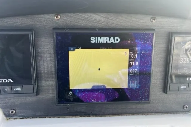 Slide: The Image of Simrad navigation display on 2020 Hurricane FunDeck 236SB OB boat dashboard. - 17