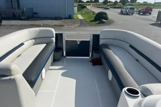 Slide: The Image of 2020 Hurricane FunDeck 236SB OB interior with spacious seating and cup holders. - 18