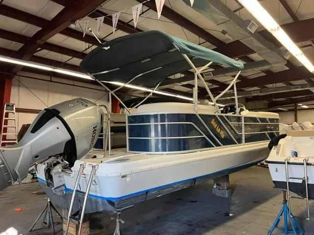 Slide: The Image of 2020 Hurricane FunDeck 236SB OB boat in indoor storage with Honda outboard motor. - 3
