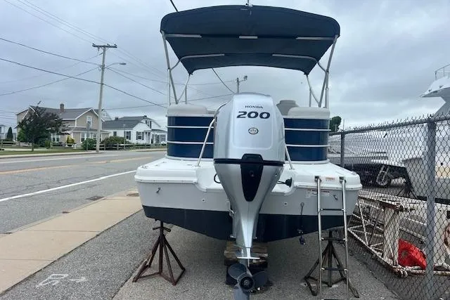 Slide: The Image of 2020 Hurricane FunDeck 236SB OB boat with Honda 200 engine on trailer. - 5