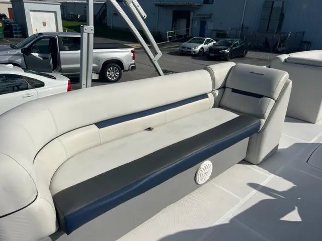 Slide: The Image of 2020 Hurricane FunDeck 236SB OB boat interior with white and navy seating. - 8