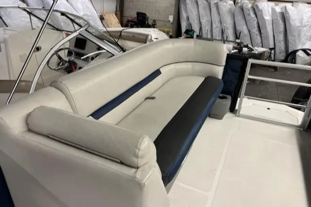 Slide: The Image of 2020 Hurricane FunDeck 236SB OB boat interior with white and blue seating. - 9