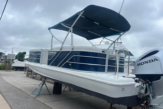 Slide: The Image of 2020 Hurricane FunDeck 236SB OB boat with canopy and Honda outboard motor. - 6
