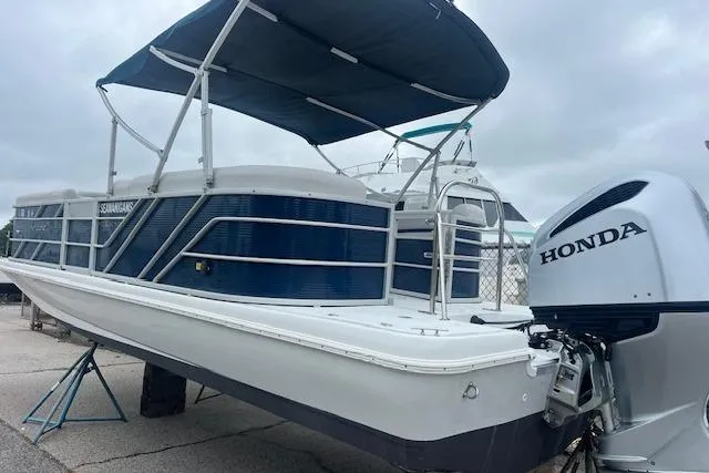 Slide: The Image of 2020 Hurricane FunDeck 236SB OB boat with Honda outboard motor and canopy. - 1
