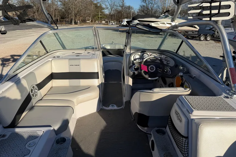 Slide: The Image of 2008 Nautique Super Air Nautique 220 boat interior with seating and dashboard. - 10