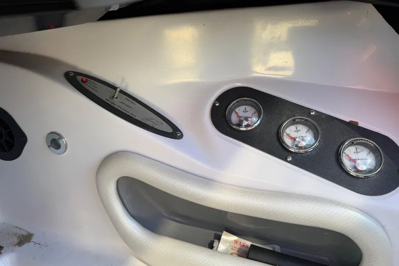 Slide: The Image of 2008 Nautique Super Air Nautique 220 dashboard with gauges and controls. - 11