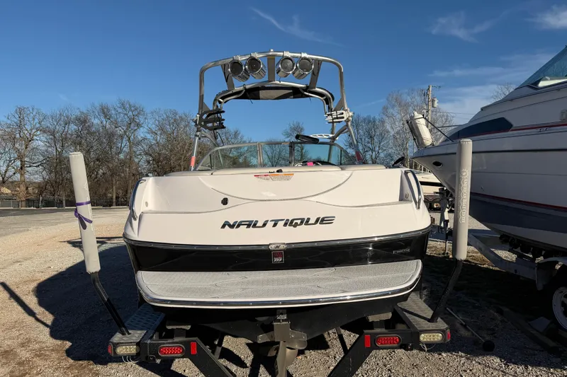 Slide: The Image of 2008 Nautique Super Air Nautique 220 boat on trailer, parked outdoors. - 3