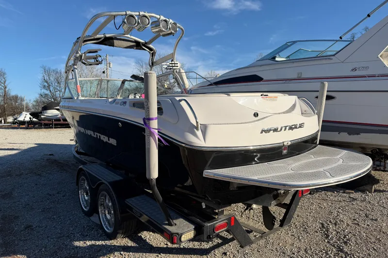 Slide: The Image of 2008 Nautique Super Air Nautique 220 boat on trailer, parked outdoors. - 4