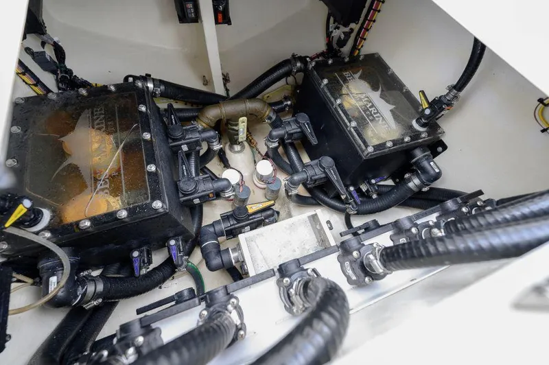 Slide: The Image of Engine compartment of 2023 SeaVee 420Z boat, showcasing dual engines and complex wiring. - 18
