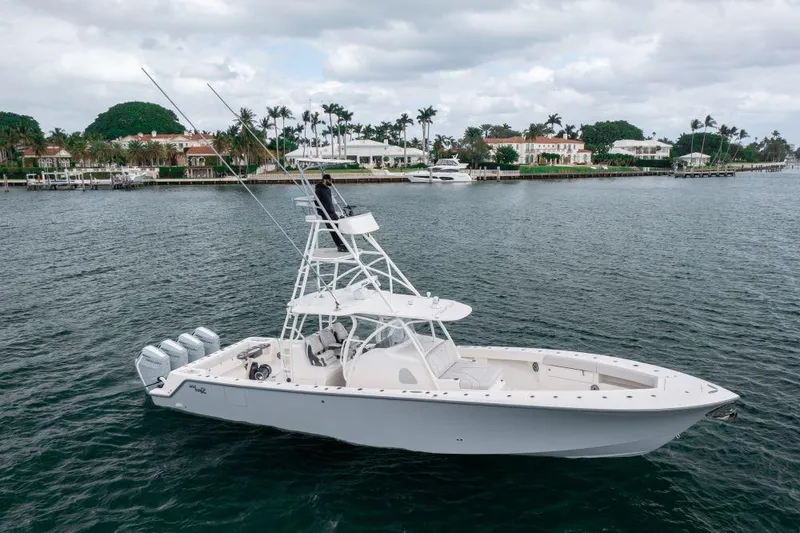 Slide: The Image of 2023 SeaVee 420Z boat on calm water with scenic background. - 3