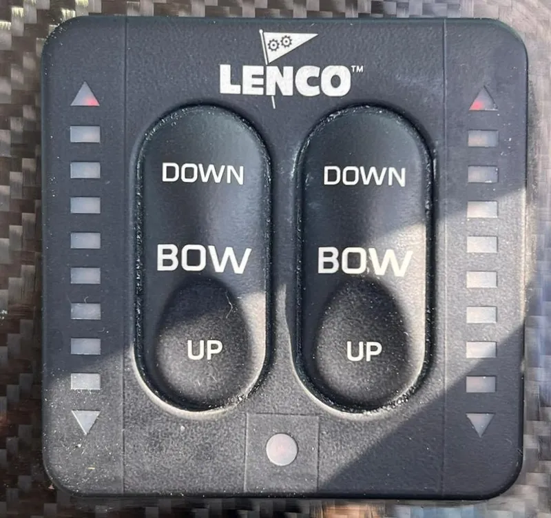 Slide: The Image of Lenco trim tab control panel on Protector Targa 28 boat, 2000 model. - 21