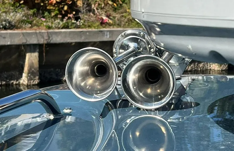 Slide: The Image of Close-up of dual chrome horns on a 2000 Protector Targa 28 boat. - 26