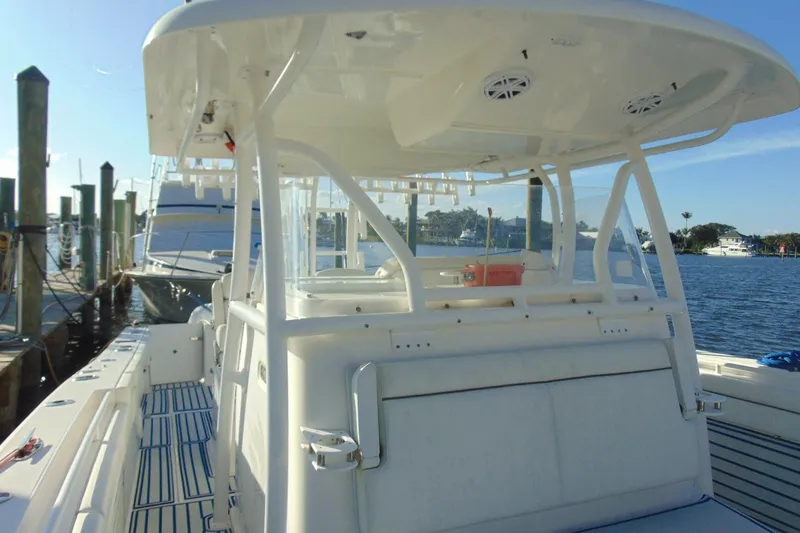 Slide: The Image of 2019 Stamas 390 Tarpon boat docked at marina, featuring spacious deck and modern design. - 10